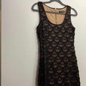 Guess, size 4, Black fringe with nude lining.